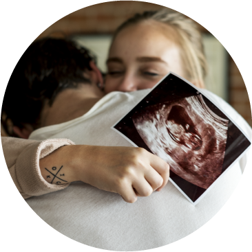 A mother looking at her baby's ultrasound image