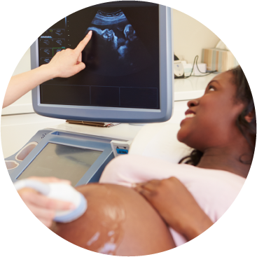 A sonographer performing an ultrasound