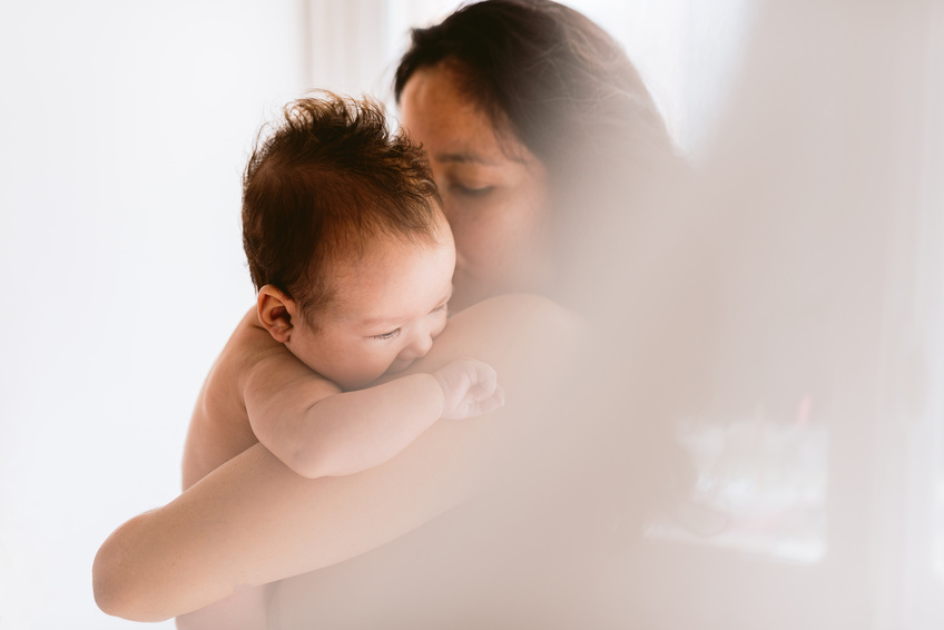 A mother holding her baby